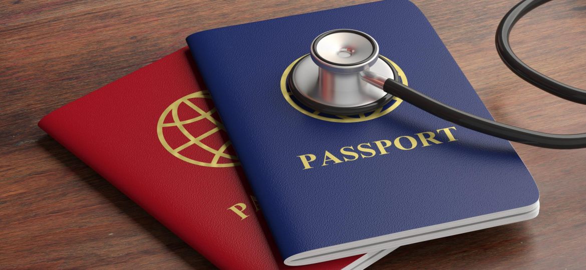 blue and red passport with stethoscope