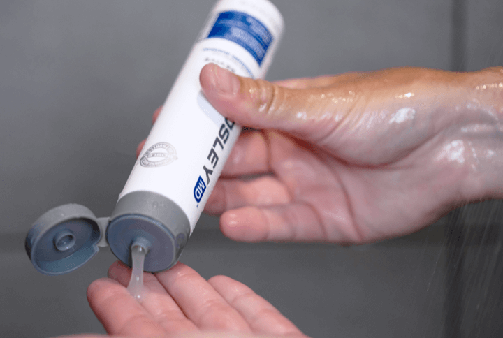 man pouring Bosley product into his hand