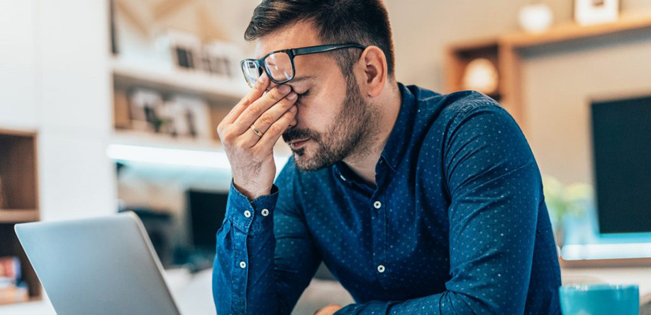 man appearing to be anxious and stressed