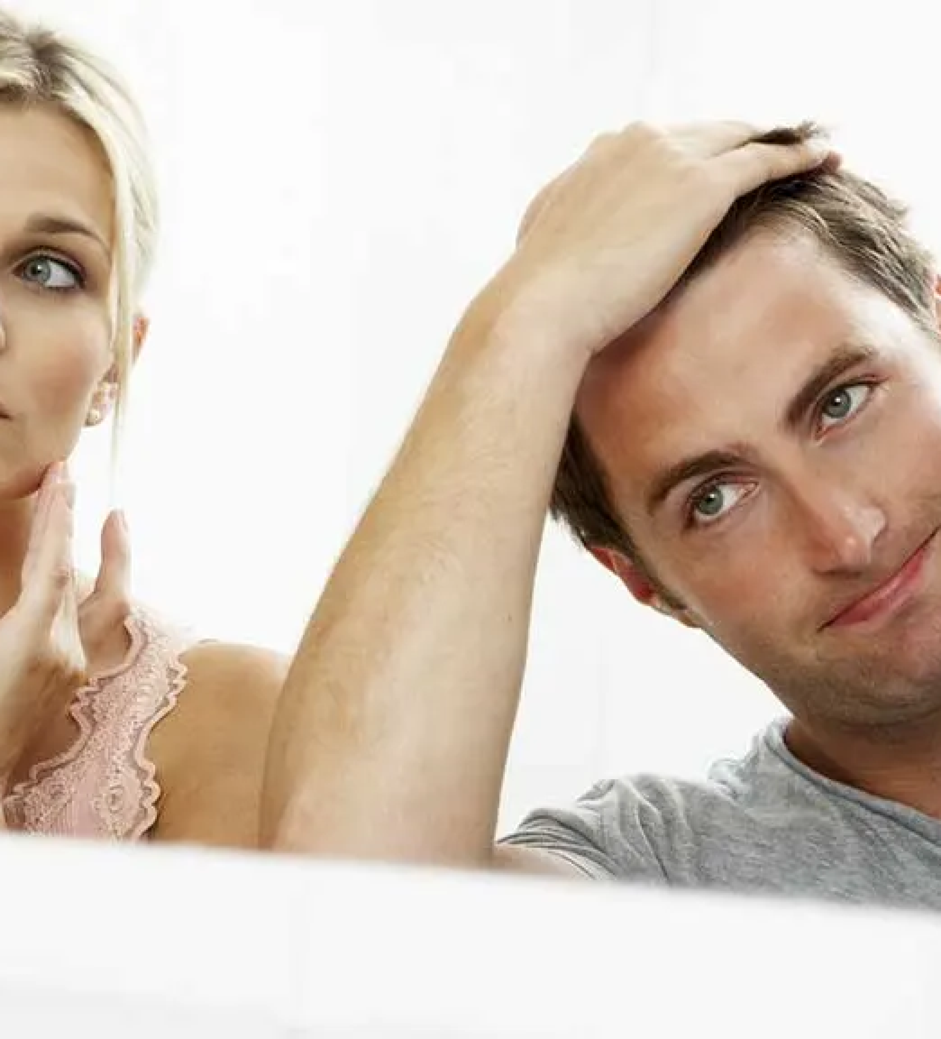 Hair Loss Test Everyone Should Know - a woman and a man looking into a mirror, each with their hand in their hair, to determine the severity of their hair loss.