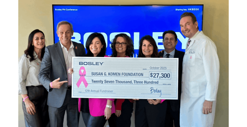 Bosley CEO and team donating check to Susan G. Komen foundation