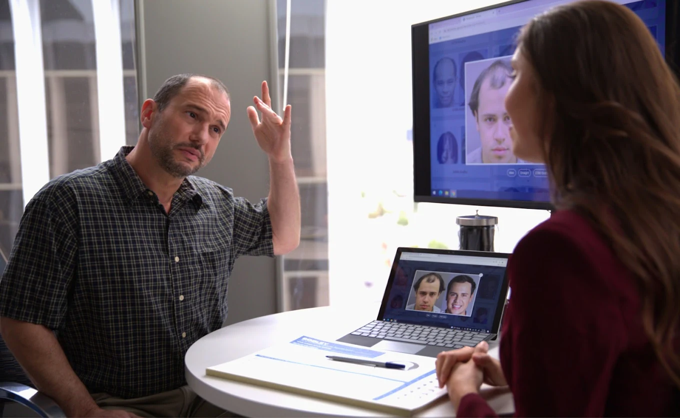 Hair transplant Atlanta consultation showing patient discussing hair restoration options with specialist